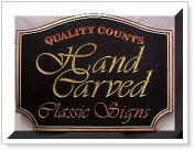 Carved wooden signs C.